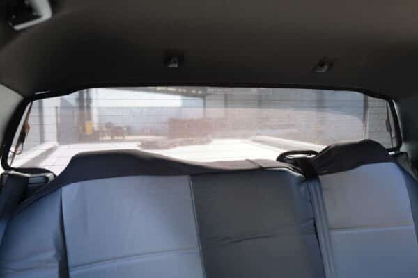 Custom-fit rear windscreen sun shades installed in a Ford Ranger 4th generation, providing UV protection and privacy.