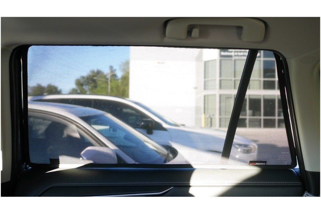 Interior view of a Toyota RAV4 5th generation with custom-fit car window sun shades installed, showcasing clear visibility and UV protection.